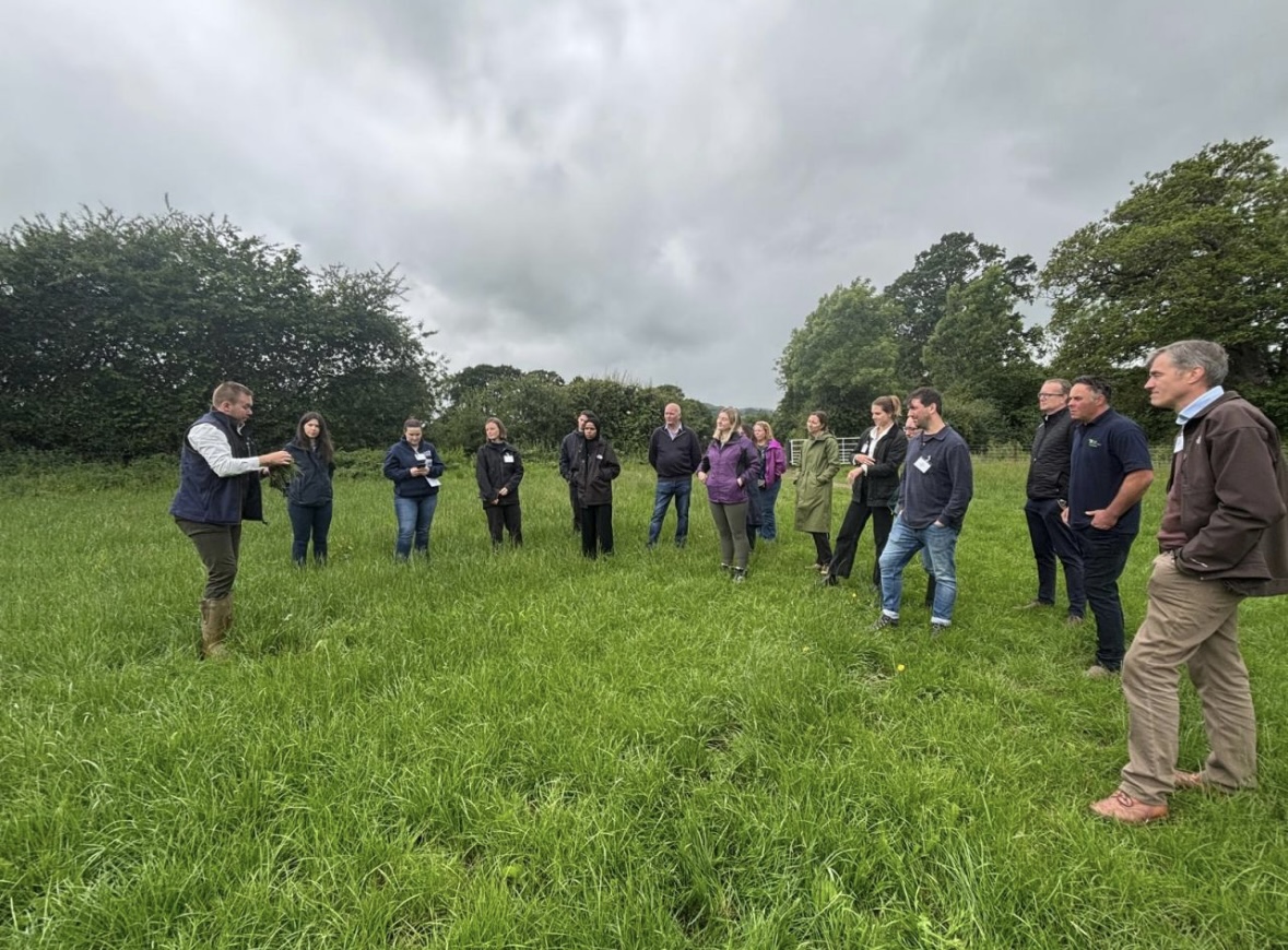 George leading a farmer group discussion in a field